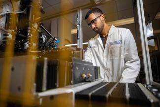 Researcher working with instrument