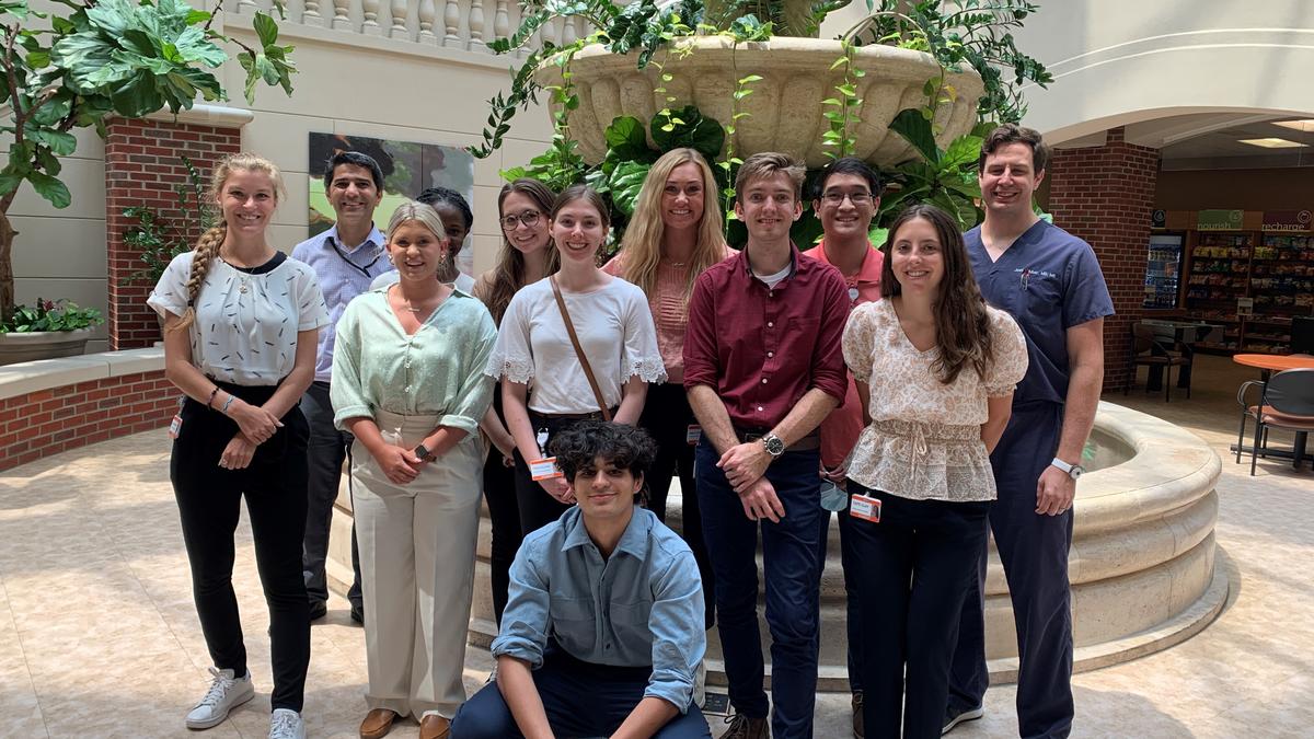 Group photo of summer clinical observational program participants and faculty