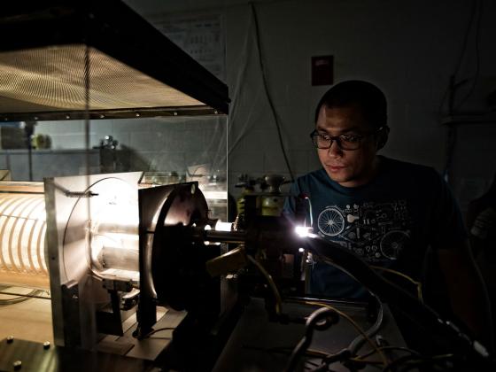 Student working with a welder in a lab.